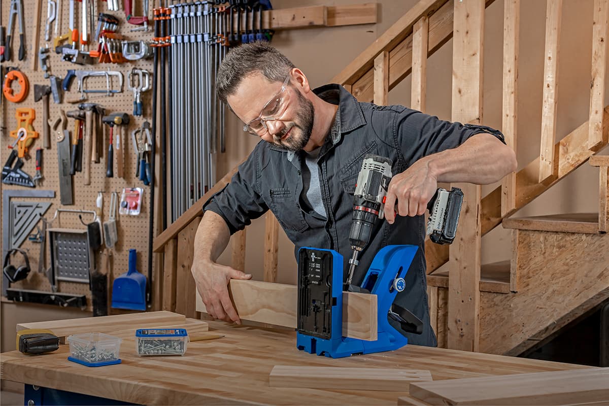 Image of a man using a KPHJ720PRO with a drill